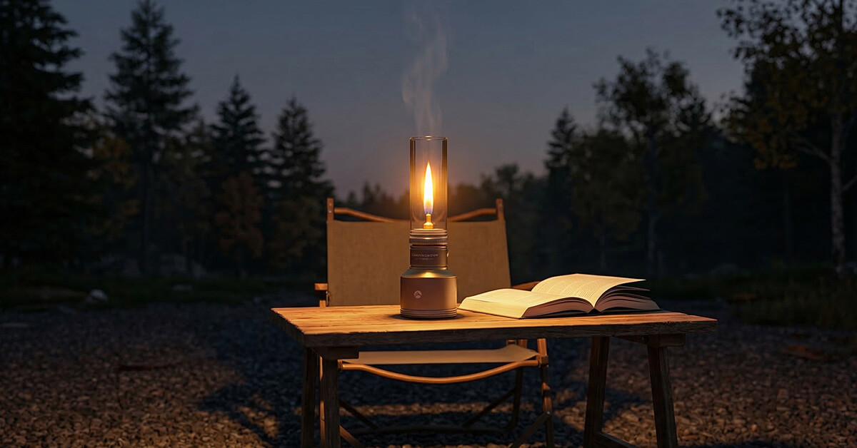 An older couple sitting in camp chairs at night, the TrailFlame on a small table between them, warm light on their faces, dark trees in the background.